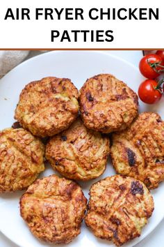 chicken patties on a white plate with tomatoes in the background and text overlay that says air fryer chicken patties