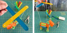 a person is making a toy airplane out of construction paper