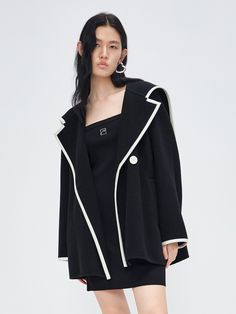 MO&Co. Women's Wool Blend Contrast Pocketed Coat Features : - Wide lapel collar- Relaxed fit- Button closure Code: MBC3OVCT02The back length of size S is 72cmMATERIALS & CARE Material: 81.4% Wool 18.6% PolyamideDo not wash, do not bleachHang to dry, do not tumble dryLow-temperature ironing, professional dry cleaningDo not put the sun under long exposureREMINDER: All items are measured manually. Please note that it's reasonable that there might be minor measurement differences (1-2cm) on some ite Chic Long Sleeve Outerwear With Contrast Collar, Designer Black Outerwear With Hidden Buttons, Designer Black Outerwear With Hidden Button Closure, Chic Outerwear With Contrast Collar For Work, Black Outerwear With Button Cuffs And Suit Collar, Black Outerwear With Suit Collar And Button Cuffs, Black Double-breasted Structured Outerwear, Designer Black Outerwear With Suit Collar, Black Structured Double-breasted Outerwear