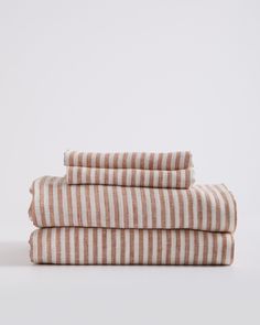 three striped towels stacked on top of each other