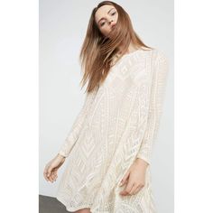 Our must-have long-sleeve dress in geometric lace falls for a semi-relaxed fit and has some stretch for all-day ease. Its semi-sheer effect is pared down with its jersey lining through the body.PulloverGeometric patchwork laceFabric: 95% nylon, 5% spandex lace; lining: 92% polyester, 8% spandex jerseyWashable, dry clean recommendedMid-weight, stretch fabricKnee-length hemlineTrue to fitModel is approximately 5'9” Chic Lace Dress With Sheer Long Sleeves, White Sheer Long Sleeve Mini Dress, Flowy Long Sleeve Dress With Lace Sleeves, Flowy Long Sleeve Lace Dresses, Lace Long Sleeve Dress For Casual Occasions, Long Sleeve Sheer Mini Dress For Fall, Bohemian Dress With Sheer Long Sleeves, Fall Lace Mini Dress With Long Sleeves, Fall Long Sleeve Lace Mini Dress