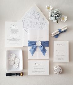 the wedding stationery is laid out and ready for guests