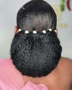 For a look of timeless sophistication, try this elegant tucked chignon. The sleek and polished style is deceptively simple to create and works beautifully with any dress neckline.  If you’re looking to replicate this hairstyle and you’re wanting to add more length - all you’ll need to achieve your chignon is hair extensions from Euphoria Afro Kinky curly hair weft from SL Raw Virgin Hair. You’ll only need (1) bundle and bobby pins. You’ll need to put your hair in a small bun and take your wefts and wrap it around your natural hair and secure it with a bobby pin while tucking hair under.  📌 Save pin for later Wedding Buns For Black Women, Bridesmaid Natural Hairstyles, African Wedding Hairstyles Natural, Gel Bolla Hairstyles, Nigerian Bridal Hairstyles, Natural Hair Wedding Styles, Sleek Top Knot, Black Bridesmaids Hairstyles