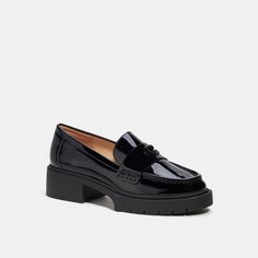 Our Leah loafer takes a timeless style to new heights with a chunky ‘90s-inspired lug sole for subtle lift. Crafted of glossy patent leather it features cushiony memory foam padding for all-day comfort and is finished with tonal Signature hardware for an iconic Coach look. | Coach Leah Loafer Shoes - Women's Size 5.5 - Black Patent Spring Patent Leather Platform Loafers For Work, Patent Leather Platform Loafers For Spring Workwear, Spring Office Platform Loafers In Patent Leather, Spring Office Patent Leather Platform Loafers, Patent Leather Platform Loafers For Work, Chic Patent Leather Loafers With Lug Sole, Fall Season Patent Leather Platform Loafers, Office Patent Leather Platform Loafers, Patent Leather Platform Loafers With Lug Sole