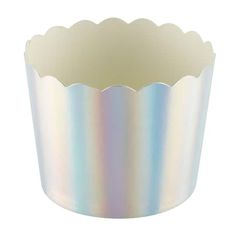 a cupcake tin with pastel holographics on the bottom and scalloped edges