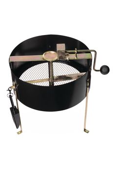 an outdoor fire pit with two tongs on the top and one in the middle