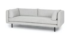 a white couch sitting on top of a wooden frame