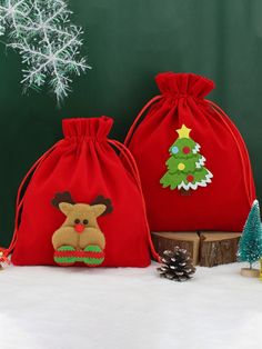 two red bags with christmas decorations on them