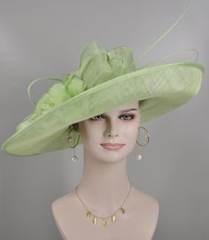 "https://www.youtube.com/shorts/0SWUprbeWfw With my little son's help, I finished the video on Youtube, it is very hard for the people to get a right size hat due to the big head size, please check the video, it will help you.  Description: This beautiful sinamay hat is an elegant wear at any church or derby event. its sinamay material is not too intimidating and attracts the eye. The chic flower adnorment that rests on the wide, side sweep brim is complemented by sinamay accentuations. Material: Sinamay with feathers Crown Width; 8 inch Crown Height: 4 inch Brim Width: 18 inches Head girth is from 22' to 23.22 \" adjustable size fits  most with an adjustable cord strap for the smaller fit If you need to  some colors on the hat to match your dress, please let me know Color on screen may va Elegant Green Fascinator For Church, Elegant Green Church Fascinator, Spring Church Fascinator In Sinamay, Spring Church Sinamay Fascinator, Elegant Green Wedding Costume Hats And Headpieces, Elegant Green Wedding Hats And Headpieces, Elegant Green Kentucky Derby Costume Hats And Headpieces, Elegant Green Costume Hats For Kentucky Derby, Elegant Green Costume Hats And Headpieces For Church