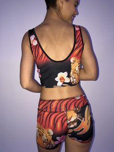 These comfortable and cute cropped bralets can be worn with the matching sports bra for added support. Paired with one of the many matching shorts, this top can be worn in the studio, as a bathing suit or out on the street. double sided with 2 different yet complimenting prints, made from recycled water bottles and spandex UV protection Red Tiger, Spaghetti Strap Top, Strap Tops, Drawstring Shorts, In The Studio, Bike Shorts, Boy Shorts, Cropped Tank Top, The Studio