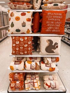 pillows are stacked on top of each other in a store