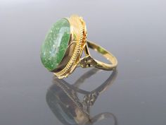 Vintage 18K Solid Yellow Gold Cabochon Green Quartz Ring....Marked 18k ...Total of weights 9.5grams...Size 7.75..Measure of stone 17.5 x 12.3MMIt's in very good condition. #461048 Gold Emerald Cabochon Ring For Formal Occasions, Antique Gold Emerald Cabochon Ring, Gold Emerald Cabochon Ring Gift, Green Quartz, Gold Snake, Domed Ring, Quartz Ring, Chain Link Necklace, Solid Yellow