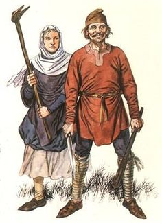 two men dressed in medieval clothing and holding spears