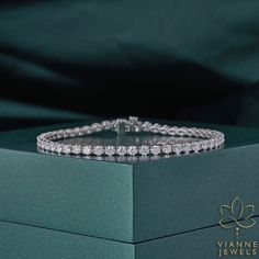 Experience the harmonious blend of cutting-edge technology and timeless beauty with our meticulously designed 5.08 TCW Round Cut Lab-Grown Diamond Bracelet. Each diamond, cultivated in a state-of-the-art laboratory setting, promises the brilliance, clarity, and allure synonymous with the finest of natural diamonds. Crafted with precision, this bracelet showcases a sequence of dazzling round-cut diamonds, set in a symmetrical design, ensuring a continuous shimmer from every angle. Beyond its aesthetic magnificence, this piece also stands as an emblem of sustainable luxury, offering the conscious consumer a chance to indulge in opulence without compromising on ethical values. Securely fastened and designed to suit various occasions, this bracelet is not just a piece of jewelry; it's an ode t Symmetrical Design, Wedding Jewelry Bracelets, Conscious Consumer, 19 Days, Wedding Bracelet, Timeless Beauty, Lab Grown, Lab Grown Diamonds, Round Cut