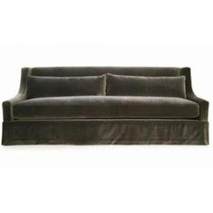 a gray couch sitting on top of a white floor