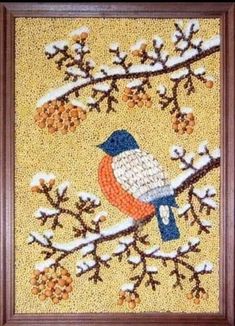 a beaded picture of a bird on a tree branch