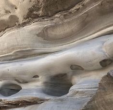 an aerial view of the desert with rocks and sand in it's foreground