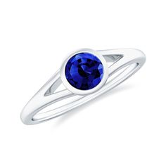 Product Details This stunning solitaire ring features a 5 MM round Created Blue Sapphire as its centerpiece, set in a bezel setting and enhanced by a gorgeous split shank design. The Created Blue Sapphire ring is crafted from solid gold, making it an eye-catching and sophisticated piece of jewelry. Product Information SKU SHP-RINGS0721121592 Width 6 mm Height 3.5 mm Weight 1.76 gm (Approximate) LAB CREATED BLUE SAPPHIRE INFORMATION No.of Stones 1 Pieces Total Weight 0.65 Carat (Approximate) Dimension(approx) Round-5X5 mm-1 Pcs Color Blue Cut Brilliant Shape Round Setting Type Other-Setting Quality Grade AAAA View More Product Parent Collection Handle lab-created-blue-sapphire-rings Blue Solitaire Birthstone Ring, Blue Solitaire Birthstone Ring With Round Stone, Blue Solitaire Birthstone Ring With Round Band, Sapphire Jewelry With Tension Setting, Classic Blue Birthstone Ring With Round Stone, Blue Solitaire Ring With Round Stone, Classic Blue Birthstone Ring, Classic Blue Ring With Bezel Setting, Blue Sapphire Ring With Bezel Setting