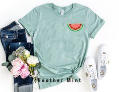 "Cute Watermelon Shirt, Watermelon Pocket Tee, Watermelon Shirt, Watermelon Boho Shirt, Vacation shirt, Cute Gift for Friends * Unisex T Shirt: \"Bella Canvas\" - Retail fit, Runs true to size. - Solid colors: 100% Ring-Spun soft cotton. Heather colors: 52% Ring-Spun cotton 48% polyester. * V-Neck T Shirt: \"Bella Canvas\" - Retail fit, Runs true to size. - Solid colors: 100% Ring-Spun soft cotton. * Women's T Shirt: \"Anvil\"  Feminine cut, Runs smaller than usual (Please use the size chart). - 100% Ring-Spun soft cotton. - Color \"Dark Grey\" is: \"Heavy Metal\". And color \"Athletic Heather\" is: \"Grey Heather\" in Women's shirts.                                                                                                   * Unisex T Shirt: \"Gildan Softstyle\" - Runs true to size. Fun Green Summer Shirt, Cute Green Summer Shirt, Green Short Sleeve Top With Fruit Print, Fun Watermelon Colored Short Sleeve Tops, Casual Watermelon Colored Short Sleeve Top, Trendy Green Tops With Fruit Print, Fun Watermelon Color Tops For Summer, Casual Watermelon Cotton Top, Casual Watermelon Short Sleeve Top