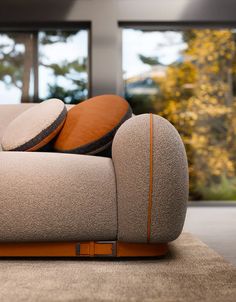 a couch with pillows sitting on top of it