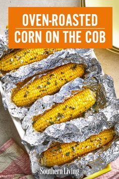 grilled corn on the cob in foil with text overlay that reads oven roasted corn on the cob