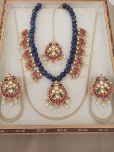 *It's Handmade Gold Plated Indian Kundan Jewelry Necklace and Earrings Set with matching tikka. *It's 22 K Gold Plated made from Silver and Copper Mix material and also using handcut stones like         shown in picture. *It's beautiful Ethnic Indian Wedding necklace with Blue lapis semiprecious beads stringing and pink blue stone combination. *It's Earrings are 2 Inch Long Chandbali. *Necklace and Earrings are same like shown in picture. *It will come with adjustable string which fits all Neck Jewelry Long Necklace, Sabyasachi Jewelry, Bollywood Bridal, Pakistani Bridal Jewelry, Jewelry Kundan, Jewelry Pakistani, Sabyasachi Jewellery, Kundan Jewelry, Chandbali Earrings