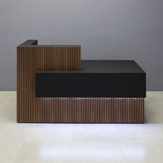 two black and brown benches sitting next to each other on top of a white floor