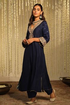 Deep blue long kaftan with placed thread embroidered paisley motifs embellished by sequins. Comes with matching doghri salwar.
Components: 2
Pattern: Embroidered
Type Of Work: Thread, Sequin
Neckline: V-neck
Sleeve Type: Three quarter
Fabric: Silk Dupion
Color: Blue
Other Details: 
Flared silhouette
Occasion: Sangeet,Mehendi and Haldi - Aza Fashions Salwar Women, Paisley Motifs, Long Kaftan, Fabric Silk, Blue Silk, Aza Fashion, Sleeve Type, Deep Blue, Three Quarter