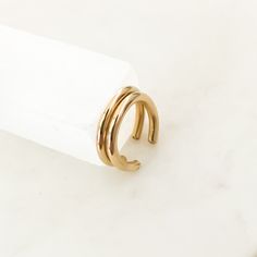 "The thickest version of our best selling ear cuffs. Handmade, 14k gold filled tarnish proof and water proof cuff earrings for comfortable wear. Simply wrap around the conch part of your ear for an effortless chic look 24/7. Wear one or stack two together! 14 gauge thickness Approx. 10 mm diameter // 2mm thickness No piercing required ✦ SHIPPING & PROCESSING: ✦ All items are handmade to order and ship out with full tracking via USPS within 2 - 4 business days. Once shipped, you will receive Simple Ear Cuff, Conch Earring, Wrap Earrings, Cartilage Hoop, Conch Piercing, Handmade Rings, Ear Cuffs, Earring Sale, Cuff Earrings