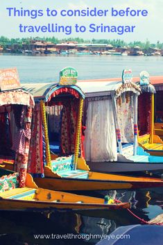 there are many small boats that have been decorated with cloths and draping