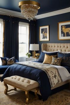 a bedroom decorated in blue and gold with a chandelier hanging from the ceiling