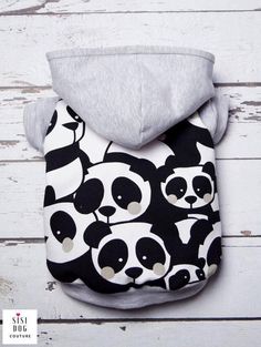 a black and white panda bear print baby bib with grey hoodie on it