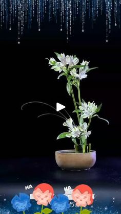 a potted plant sitting on top of a table next to blue and white flowers