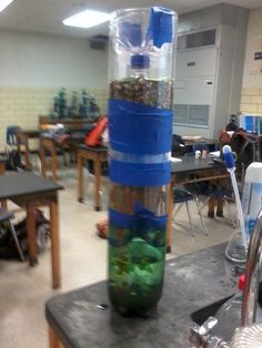 a large container filled with lots of rocks on top of a table in a room