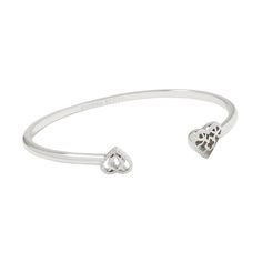 Wear your heart on your sleeve with the Anna Filigree Cuff Bracelet. A delicate cuff bookended with adorable heart stones, this bracelet will become your sweetest stack staple. No matter the size of your wrist, this adjustable cuff will fit you and your style. Designer, founder, and philanthropist Kendra Scott started her company in 2002, just three months after her first son was born. Her commitment to innovation, quality, customer service, and detail has taken her from a small startup to a bil Affordable Silver Heart Bracelet, Kendra Scott Jewelry Silver, Trendy Nickel-free Silver Cuff Bracelet, Kendra Scott Heart Bracelet, Silver Kendra Scott Bracelet, Heart Stones, Target Gifts, Brass Cuff Bracelet, Brass Cuff