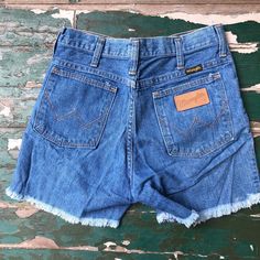 Vintage 1970s Wrangler cut off jean shorts  Excellent vintage condition with no flaws found  Measurements taken laying flat  Waist 28  Hips 36  Rise 11  Inseam 4.5 Retro Cotton Cutoff Shorts, Retro Cutoff Shorts With Frayed Hem, Retro Cotton Jean Shorts With Frayed Hem, Retro Cotton Shorts With Frayed Hem, Retro Cutoff Bottoms With Frayed Hem, Vintage Cutoff Jean Shorts In Medium Wash, Retro Cutoff Jean Shorts With Frayed Hem, Vintage Medium Wash Cutoff Jean Shorts, Vintage Medium Wash Jean Shorts With Frayed Hem