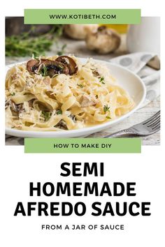 a white plate filled with pasta and mushrooms on top of a table next to garlic