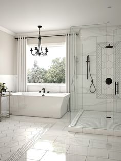 a white bathroom with a tub, shower and sink in it's corner area