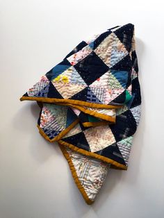 three pieces of quilt sitting on top of each other