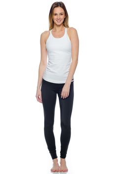 Elevate your basics with the Hard Tail Double Cross Tank. Featuring a White hue, with a high cut neckline, and a double cross design in back, this tank boasts chic style and freedom of movement. Made of a soft, flexible cotton/lycra blend fabric, with a built-in shelf bra, this tank offers comfortable style for in and out of the studio. Wear this tank for yoga, barre, gym sessions, or for everyday style.     Get the Deets:    High cut neckline, for full coverage.  Semi-fitted.  Pre-shr Apparel Branding, Yoga Barre, Yoga Clothing, Simple Top, Long Torso, Cross Design, Cross Designs, Shelf Bra, High Cut