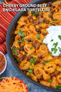 cheesy ground beef enchilada tortellini in a skillet