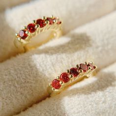 Add a serious spark to your ear stack with these garnet birthstone huggies. These dainty garnet earrings hug tightly around the earlobe. Perfect for stacking with more huggies, studs or ear cuffs.  Garnet is also known as January birthstones.  D E T A I L S - Materials: 14k gold over sterling silver. They are 14k gold THICK plated, and they can last for a very long time with proper care.  - Stone: 5 High-quality garnet cz stones.  - Inner diameter: 9mm. Outer diameter: 12mm.  - Hypoallergenic, nickel, and lead-free. H O W ∙ T O ∙ O R D E R Select your gemstone in the drop-down menu.  O T H E R ∙ I N F O R M A T I O N * All items are nicely packaged and ready to gift in elegant jewelry boxes. * If you can't find the information you need or need some advice for your design? Feel free to cont Small Hoop Huggie Earrings With Birthstone For Anniversary, Anniversary Birthstone Huggie Earrings In Small Hoop, Anniversary Small Hoop Huggie Earrings With Birthstone, Red Huggie Earrings For Gift, Red Huggie Hoop Earrings As Gift, Red Huggie Earrings Gift, Anniversary Birthstone Huggie Hoop Earrings, Red Small Hoop Jewelry For Anniversary, Red Gemstone Hoop Earrings Gift