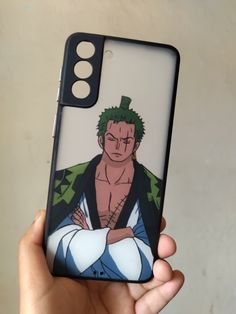 a person holding up a phone case with an anime character on it