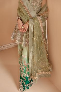 Mint Green Wedding Dress Pakistani in Peplum Style is an elegant attire that is hand-crafted with luxury details and embellishments. Premium quality fabric and a lavish blend of colors make this beautiful Pakistani Wedding Dress your priority for the big day. Pakistani Peplum The beautiful peplum comes in an alluring mint green shade and it has premium organza fabric. Beautiful silverwork and shimmering ornaments enhance the glamour of the perfectly stitched Peplum frock. Pakistani Trouser The e Green Wedding Dress Pakistani, Mint Green Wedding Dress, Wedding Dress Pakistani, Green Wedding Dress, Mint Green Wedding, Wedding Dresses Pakistani, Dress Pakistani, Wedding Mint Green, Green Wedding Dresses