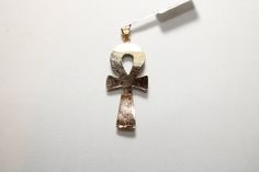 "Egyptian Ankh Cross Key of Life Turquoise 18K Yellow Gold Pendant 4.5Gr Weight Approximate : 4.5 Gr Height : 1.8\" = 48 mm Width : 0.7\" = 18 mm ✔ IT IS Tested & SIGNED WITH THE EGYPTIAN Gold Government HALLMARK FOR 18K GOLD to Ensure Authenticity. ✔ Lovely gift idea ABSOLUTELY GORGEOUS, LOOKS FABULOUS ON. ✔ 100% Egyptian handmade. ✔ Condition: A brand-new, exactly as on the photos. ★ GIFTS ✔ All items are packaged in a paper jewelry gift box, ready for gifting. ✔ If you are sending a gift Symbolic Brass Cross Jewelry, 14k Gold Ankh Spiritual Jewelry, Spiritual 14k Gold Ankh Jewelry, Bronze Crucifix Jewelry Gift, Bronze Crucifix Jewelry For Gifts, Antique Gold Ankh Jewelry, Handmade Yellow Gold Ankh Jewelry, Handmade Ankh Jewelry In Yellow Gold, Antique Ankh Jewelry As Gift