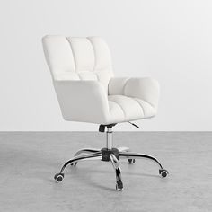 a white office chair sitting on top of a cement floor