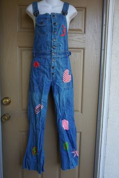 Vintage 70s Hang Ten denim overalls. Upcycled with patches. RARE! Good vintage condition.  measurements taken across front lying flatwaist 14.5" at waistbandinseam 30"19" hip Retro Bib Front Overalls In Medium Wash, Retro Denim Bib Front Jumpsuit, Retro Medium Wash Bib Front Overalls, Retro Denim Jumpsuit With Bib Front, Retro Cotton Jeans With Bib Front, Retro Bib Front Cotton Jeans, Retro Cotton Bib Front Jeans, Retro Medium Wash Cotton Denim Jumpsuit, Retro Medium Wash Cotton Overalls