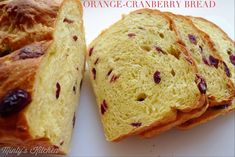 slices of orange cranberry bread on a white plate