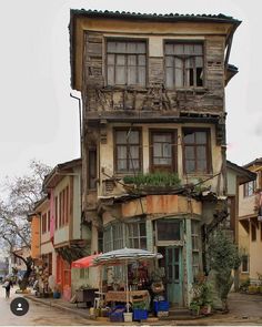 an old building with lots of windows and balconies on the side of it