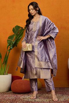 Grab this beautiful 3-piece set. The set comes with ethnic motif printed straight shape kurta has v neck, 3/4th sleeves & calf length teamed with solid trouser pant with side pocket and a dupatta. Color - Lavender Kurta Fabric-Silk Blend Pant Fabric-Silk Blend Dupatta Fabric - Silk Blend Neck-V Neck Sleeves-3/4th Sleeves Work -Ethnic Motif Print Detailing Washing Instructions-Dry Clean DISCLAIMER - The color of the product may be differ due to screen settings of device. A misprint here and a color drop slip there is the beauty of printing which is not treated as a defect. Indian Pants, Printed Suit, Lavender Silk, Fabric Silk, Churidar, Suit Set, Fabric Shop, Formal Wedding, Trouser Pants